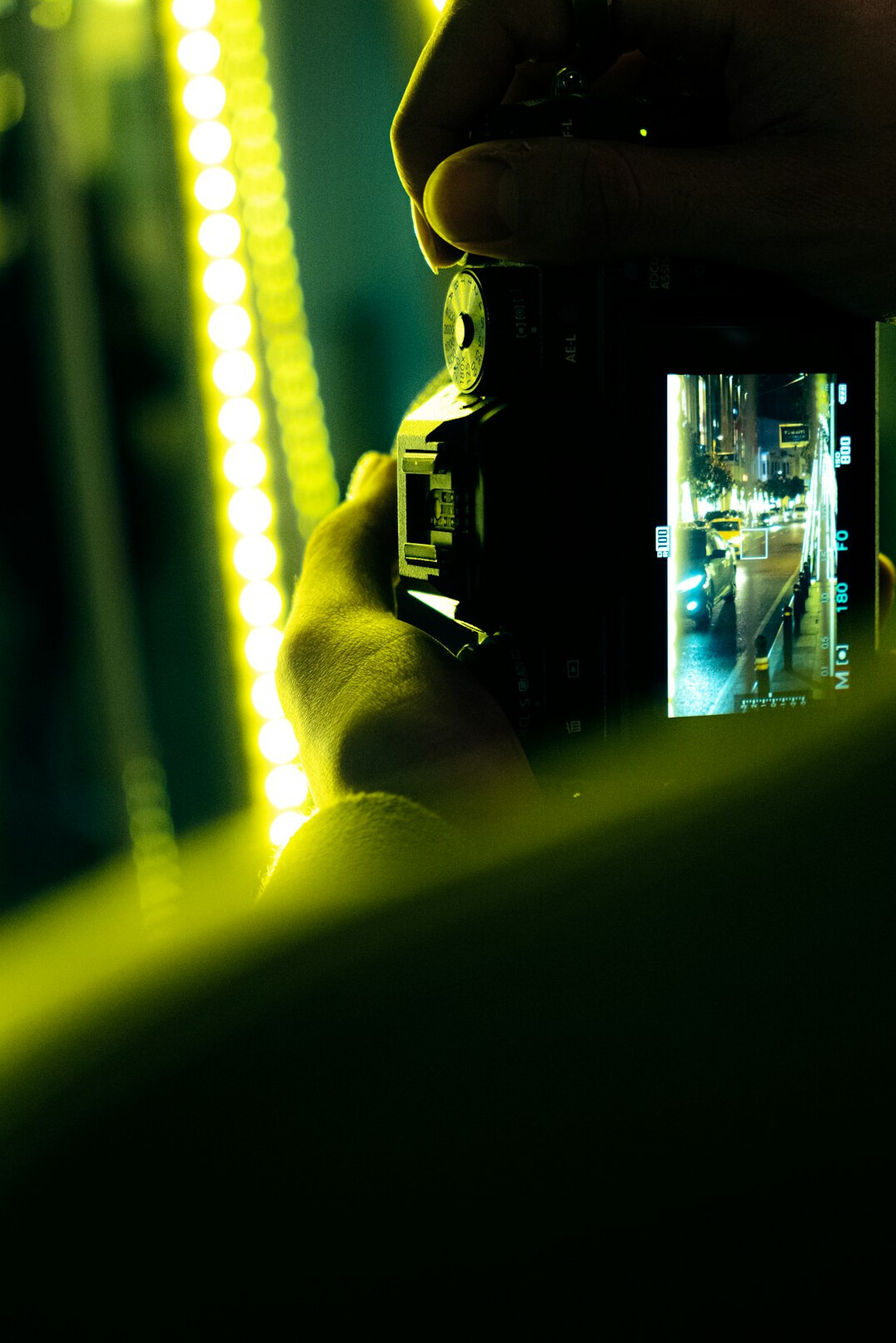 Camera operator rehearsing a tracking shot on a studio set